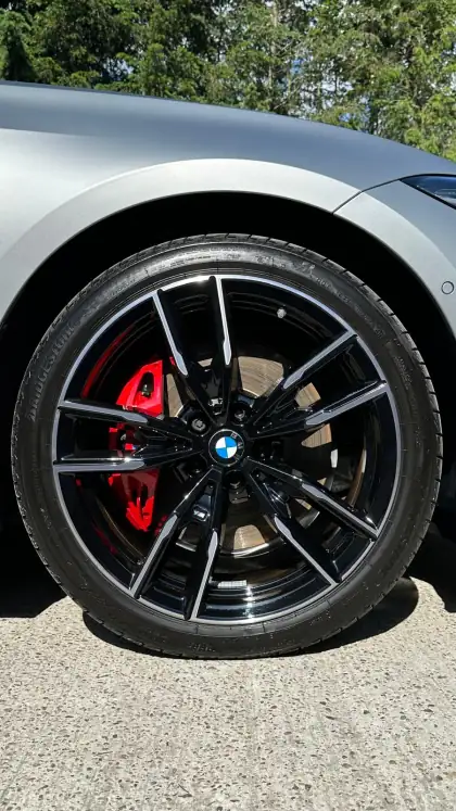 Black BMW wheel and red brake caliper
