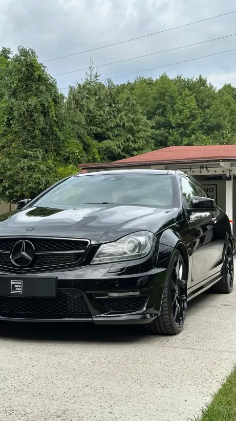 Black Mercedes Coupé outside the Brand New Car studio