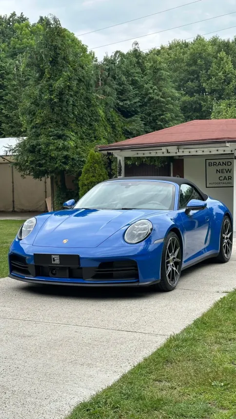 Blue Porsche 911 Cabriolet outside the Brand New Car studio