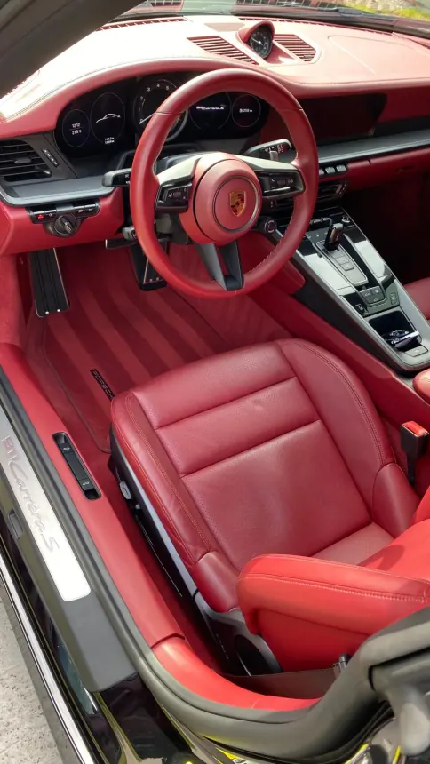 Red leather upholstery and dashboard of a Porsche 911